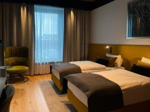 Postel nebo postele na pokoji v ubytování Fabryka Wełny Hotel & Spa