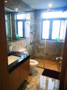 a bathroom with a shower and a sink and a toilet at Sofia Superior Suite 2R2B-61258 at R&F Princess Cove in Johor Bahru