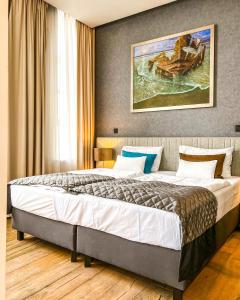 Postel nebo postele na pokoji v ubytování Fabryka Wełny Hotel & Spa