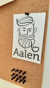 a card with a drawing of a man with a beard at Bude 23 - Ferienwohnung Aalen in Aalen