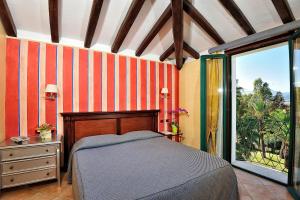 Кровать или кровати в номере Hotel Arbatasar