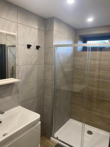 a bathroom with a shower and a sink at Pinchbeck B&B in Pinchbeck