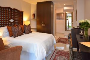 Giường trong phòng chung tại Ridgeworth Boutique Guesthouse