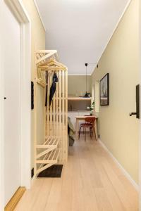 a hallway with a staircase in a house at Fresh studio apartment, a short walk from Bryggen in Bergen