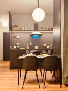 a dining room with a table and two chairs at House 74 in Verona