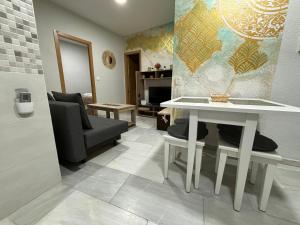 Posedenie v ubytovaní Apartamento céntrico en Plaza San Miguel