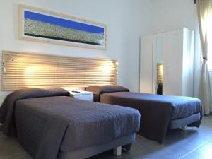 Postel nebo postele na pokoji v ubytování Le Signorine