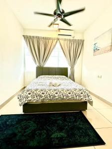 a bedroom with a bed and a ceiling fan at Casa Budi Dwiputra 15 Putrajaya in Putrajaya