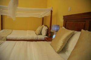 Postel nebo postele na pokoji v ubytování Fort Suites