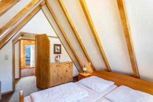 a bedroom with two beds in a attic at Ferienhaus Moritz in Siegsdorf