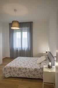 En eller flere senge i et værelse på La Casa dei Racconti