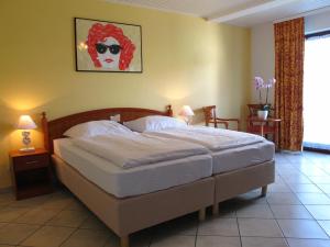Postel nebo postele na pokoji v ubytování Seehotel Lönö