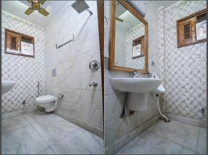 a bathroom with a sink and a toilet at Hotel moon light in Rājgīr