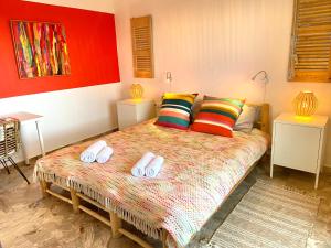 A bed or beds in a room at The Beachhouse Apartments