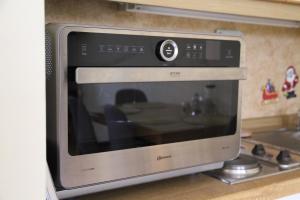 a microwave oven sitting on top of a kitchen counter at Family Apartment MiniGlück in Sankt Englmar +43 photos