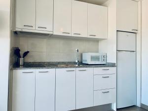 Kuchyň nebo kuchyňský kout v ubytování Hauzify I Apartaments Palace