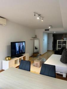 A bed or beds in a room at Barcelona Sagrada Familia Apartment