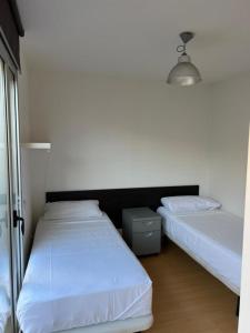 A bed or beds in a room at Barcelona Sagrada Familia Apartment