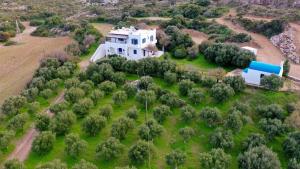 an aerial view of a large white house on a field at VILLA BLEFOUTI at BLEFOUTI BEACH in Parthénion