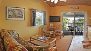 a living room with a couch and a table at Manatee Bay Inn in Fort Myers Beach
