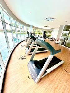 a gym with cardio machines in a building at Casa Budi Dwiputra 15 Putrajaya in Putrajaya