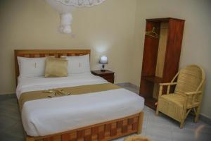 Postel nebo postele na pokoji v ubytování Fort Suites