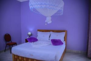 Postel nebo postele na pokoji v ubytování Fort Suites