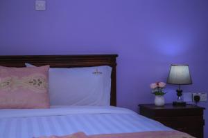 Postel nebo postele na pokoji v ubytování Fort Suites