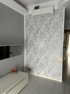 a wall mural in a room with a white wall at Appartamento Seriate/Confine Bergamo in Seriate