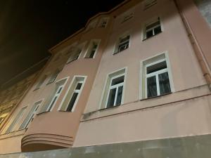 a building with windows on the side of it at Penzion Sokolov in Sokolov