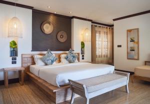 Postel nebo postele na pokoji v ubytování Hotel L'Archipel