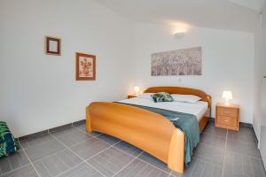 Postel nebo postele na pokoji v ubytování Villa Dada