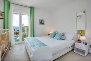 Postel nebo postele na pokoji v ubytování Villa Dada + 37 fotografií