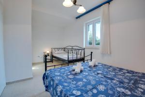 Postel nebo postele na pokoji v ubytování Villa Dada