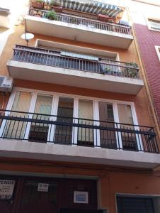 an apartment building with a balcony on the side of it at PARRA HOME y garaje, Algemesi Home in Algemesí