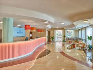 a lobby of a hospital with a waiting room at Serenusa Resort in Licata