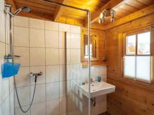 a bathroom with a sink and a shower at Blockhütte Tirol in Ried im Oberinntal
