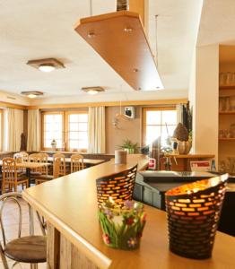 a kitchen and dining room with a table and chairs at Wohnfass rechts in Ried im Oberinntal