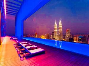 a rooftop bar with a view of the city at amazing suites at platinum suites in Kuala Lumpur