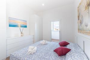 Postel nebo postele na pokoji v ubytování Piombino Apartments - Casa Chiassatello + 2 fotografie