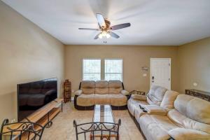 a living room with couches and a ceiling fan at 30A Getaway Too! in Santa Rosa Beach