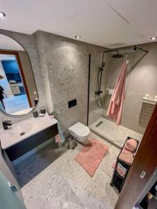 a bathroom with a sink and a toilet and a mirror at Studio Haven in the Old Medina in Casablanca +9 photos