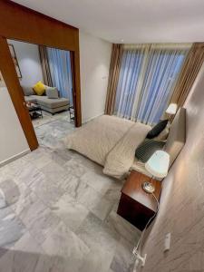 a large living room with a couch and a table at Studio Haven in the Old Medina in Casablanca