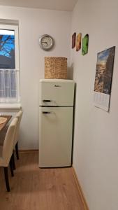 Kuchyňa alebo kuchynka v ubytovaní Apartmán Pálenica II