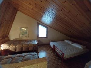Ένα ή περισσότερα κρεβάτια σε δωμάτιο στο Casa vacanze Pievepelago