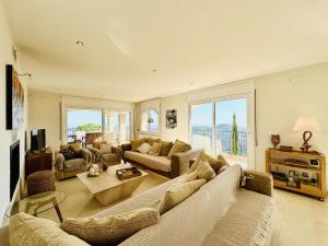 a large living room with a couch and a table at Aurea CostaBravaSi in Sant Feliu de Guíxols