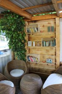 a room with two chairs and a book shelf at Vita Mia in Pazin