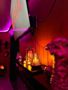 a room with a table with candles and a teddy bear at LA LOVEROOM by Sunnyroom in Perpignan +17 photos