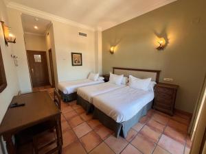 Posteľ alebo postele v izbe v ubytovaní Hotel Sierra de Ubrique