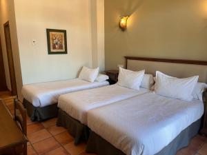 Posteľ alebo postele v izbe v ubytovaní Hotel Sierra de Ubrique